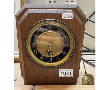 A 1920's oak mantel clock.