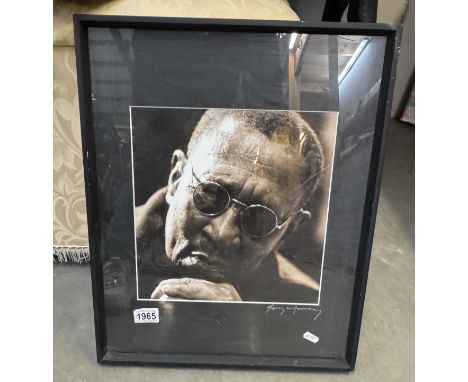 A framed &amp; glazed black &amp; white portrait indistinctly signed Gerry Munnery