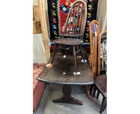 An Ercol table with 2 chairs