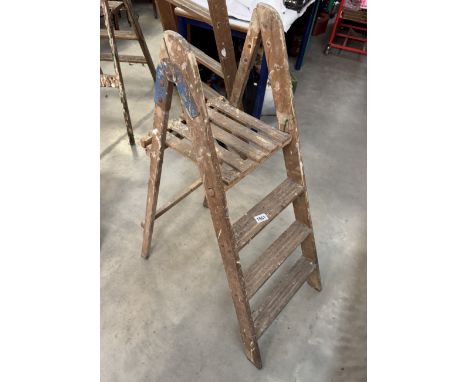 A vintage wooden step ladder