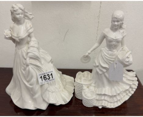A pair of unbranded white glazed ceramic figurines