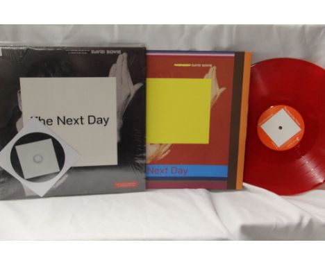 A NM/NM copy of David Bowie album 'Next Day' incredibly hard to find 'Paul Smith' red vinyl Polish press with CD