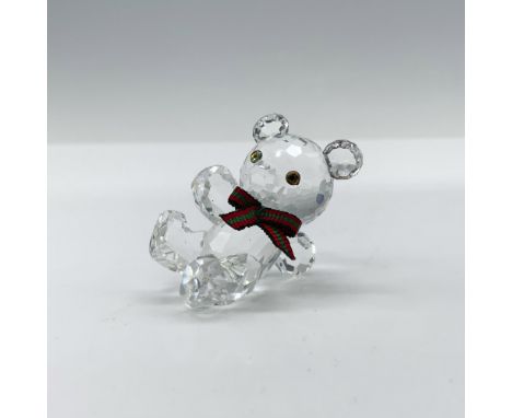 Lovely crystal Kris Bear that is modeling a ribbon of green and red fabric around his neck and was part of the When we were Y