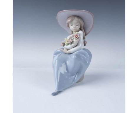 This is a beautiful Lladro porcelain figurine titled "Que Bonita Es La Primavera," also known as Fragrant Bouquet. Model numb