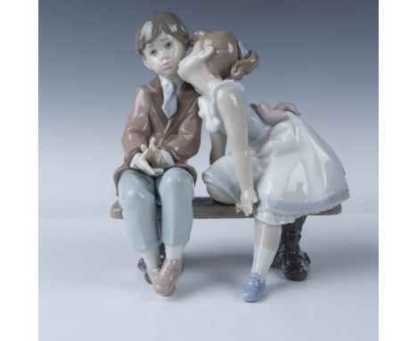 Lladro Ten and Growing figurine, model number 07635, features a heartwarming scene of a young girl giving a sweet kiss on the