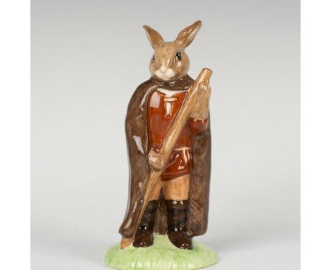 A figure of the character from the classic folklore, wearing a long brown cape and holding a wooden stick. Part of the Robin 
