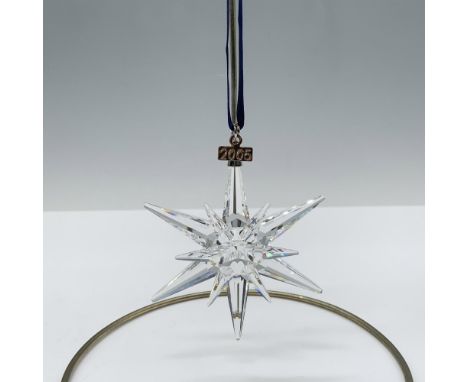 Limited edition crystal ornament with a metal tag reading 2005 that features 6 short points and 6 long points to complete a b