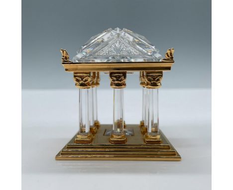 Beautiful faceted crystal with gold metal-toned details. Swarovski mark on base. Swarovski mark on base. This item has its or
