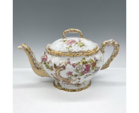Hand painted delicate design of colorful florals with gilt accents over white porcelain on teapot and lid. L.S.&amp;S. Limoge