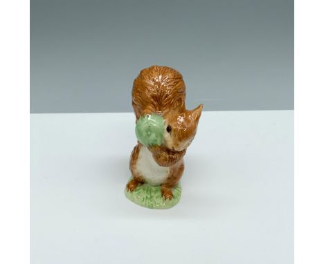 Glossy porcelain figurine of a little critter holding a ball. Royal Albert Beatrix Potter backstamp. This item has its origin
