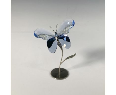 A stunning butterfly with lavender and sapphire crystal wings adorned with tiny gemstones, and a silver-toned metal body. Swa