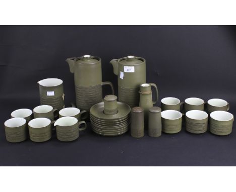 A Denby six setting part tea service and coffee service. Glazed in green with textured exteriors