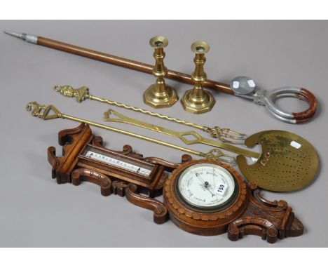 An early 20th century carved oak banjo barometer with a white enamel dial, 61cm high (w.a.f.); together with an aluminium sho