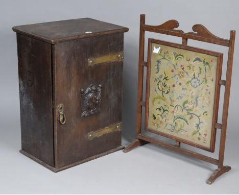 An oak small cupboard having a fitted interior enclosed by a carved panel door, 52cm wide x 75cm high x 37cm deep; &amp; an o
