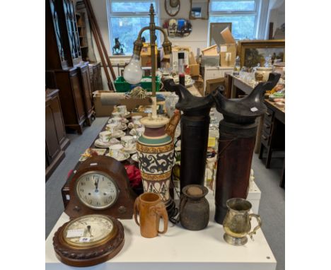 An early 20th century wall barometer having a white enamel dial, &amp; in an oak case with rope-twist border, 24cm diameter; 