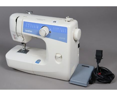 A Brother “LS-2/25” electric sewing machine; &amp; a vintage JVC video camera, with various accessories.