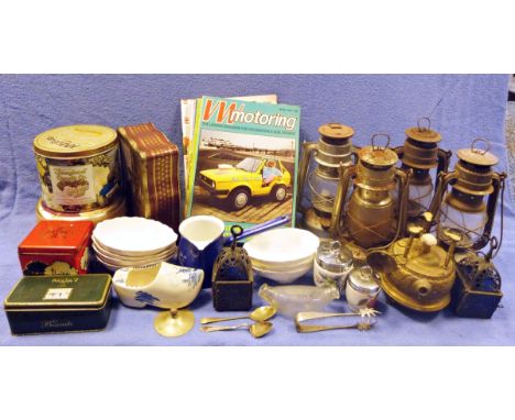 Four metal paraffin lamps, various volumes of VW Motoring magazine, a folding mirror, a print by Dawn M Goodson and assorted 