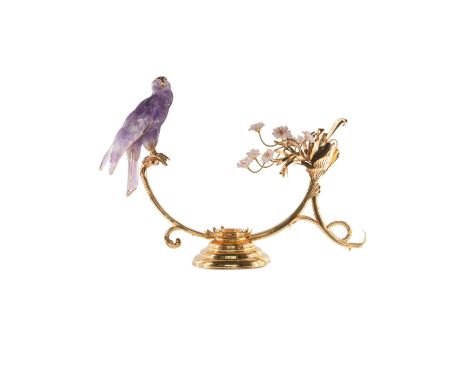 A FINE & RARE YELLOW METAL & DIAMOND SET OBJET D'ART MODEL OF A FALCON ON PERCHCIRCA 1980sCarved amethyst Falcon with diamond