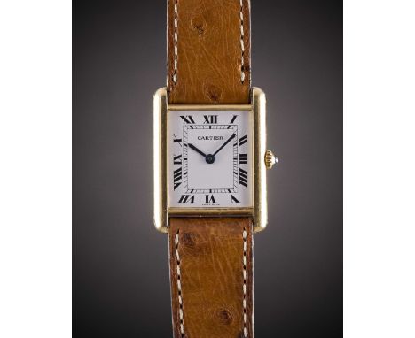 A GENTLEMAN'S SIZE 18K SOLID GOLD CARTIER TANK WRIST WATCHCIRCA 1990sMovement: Quartz, signed Cartier.Case: Approx. 31mm by 2