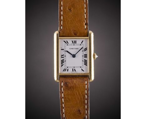 A GENTLEMAN'S SIZE 18K SOLID GOLD CARTIER TANK WRIST WATCHCIRCA 1990sMovement: Quartz, signed Cartier.Case: Approx. 31mm by 2