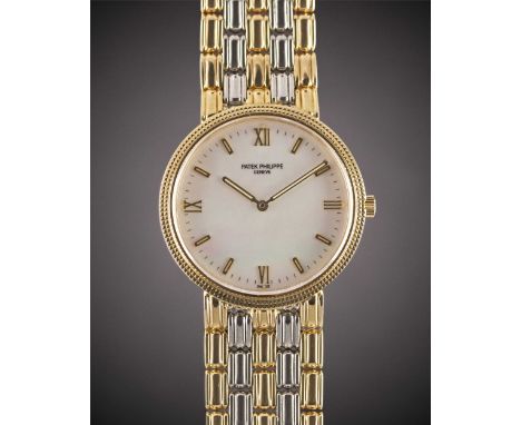 A GENTLEMAN'S SIZE 18K SOLID YELLOW & WHITE GOLD PATEK PHILIPPE CALATRAVA BRACELET WATCHCIRCA 1980s, REF. 3944/20 WITH MOTHER