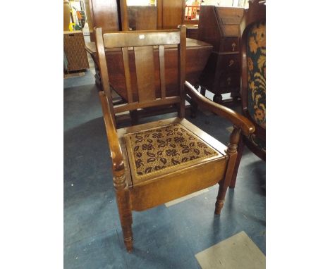 An Edwardian Oak Commode Arm Chair 