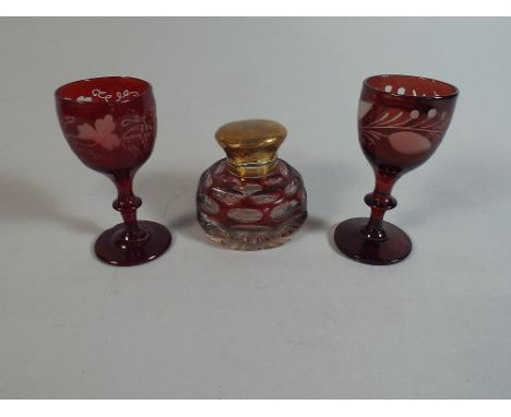 A Pair of Bohemian Overlaid Ruby Glasses and an Overlaid Ruby Glass Inkwell with Brass Lid