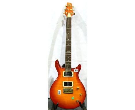 Solid body electric guitar by Vintage. Not available for in-house P&amp;P, contact Paul O'Hea at Mailboxes on 01925 659133 