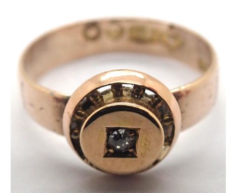 A Victorian 9ct gold band surmounted with a single gold set diamond, size L/M, 2.2g. P&amp;P Group 1 (£14+VAT for the first l