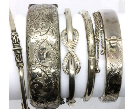 Five sterling silver bangles of mixed designs. P&amp;P Group 1 (£14+VAT for the first lot and £1+VAT for subsequent lots) 