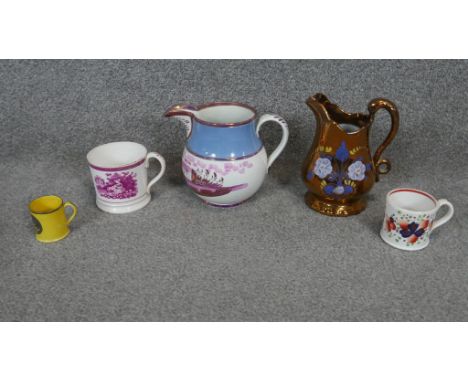 A collection of 19th century lustreware jugs and cups. Including a Sunderland ware jug painted with a manor house and trees, 
