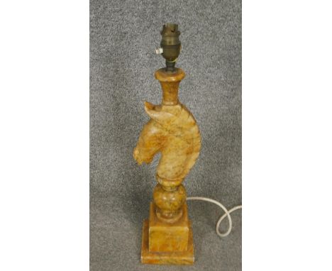 A vintage carved alabaster table lamp in the form of a horses head on stepped base. H.49cm 
