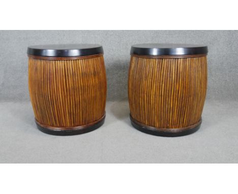A pair of contemporary lamp tables with ebonised tops and bamboo sides. H.57 W.50cm 