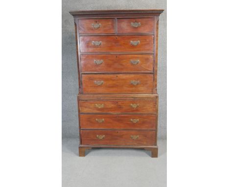 A Georgian mahogany chest on chest with dentil cornice and brushing slide resting on bracket feet. H.193 W.107 D.53cm 