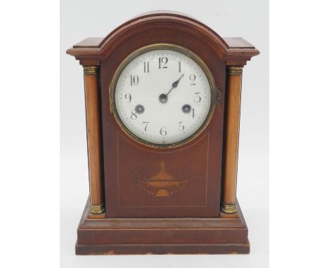 A C.1900 mahogany cased mantel clock with Classical urn and husk swag inlay. H.31cm 