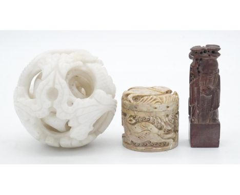 A collection of Oriental carved hardstone items. Including a 3 layered white marble dragon and phoenix magic puzzle ball, a C