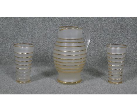 A vintage frosted glass lemonade jug and matching tumblers. 