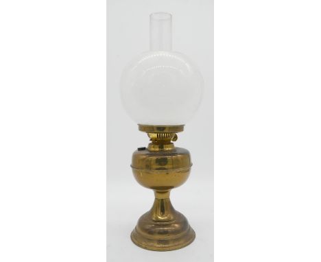 A Duplex brass oil lamp with milk glass globe shade. makers stamp to the wick turner. H.50cm 