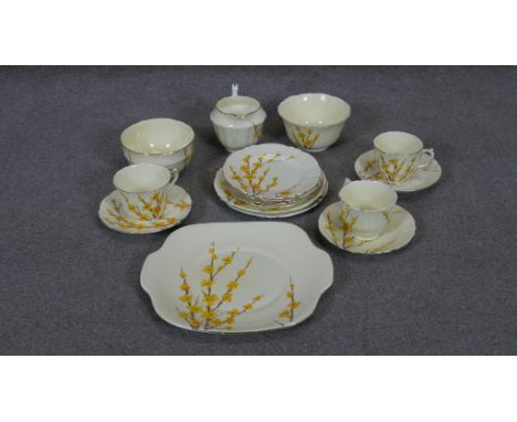 An antique Crown Staffordshire hand painted 
china tea set. Includes 3 cups with saucers, four small plates, two large plates