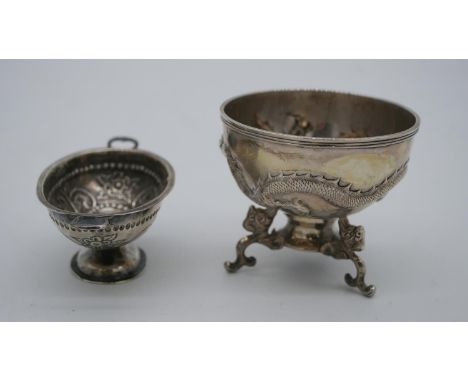 Two Chinese silver bowls. One by Wah Hing a repousse dragon design bowl on a triple dragon head form stand, makers stamp to t