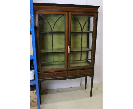 Marquetry inlaid mahogany display cabinet with glazed doors and two short drawers, raised on square tapered legs with arrow h