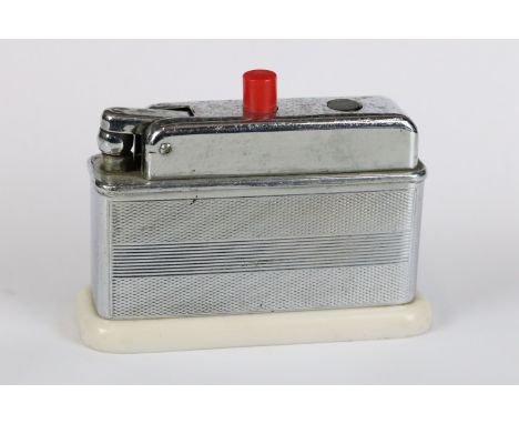 Art Deco chrome and Bakelite table lighter by Barclay, with red and black switches, 10.5cm long