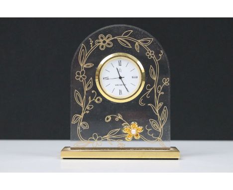 Mikimoto timepiece (clock), the translucent arch shape with applied gilt flower head with pearl centre, 9.5cm high