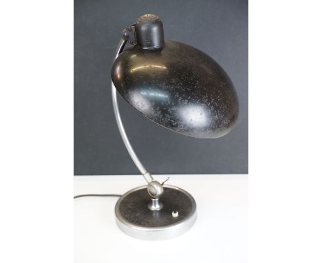 Original Kaiser-Idell black enamel lamp on curved stand and circular base, approx. H 46cm