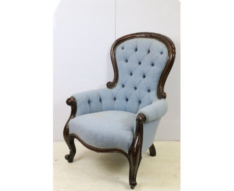 Carved button back fireside gentleman's chair, shaped relief detail back, serpentine front rail, carved shaped cabriole legs 