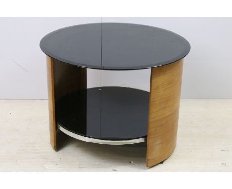 Curved teak side lamp table with black glass top, diameter 61cm