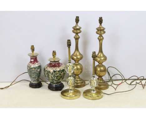 Selection of lamp bases to include oriental ginger jar styles atop wooden bases, two spherical glass globe examples and a pai