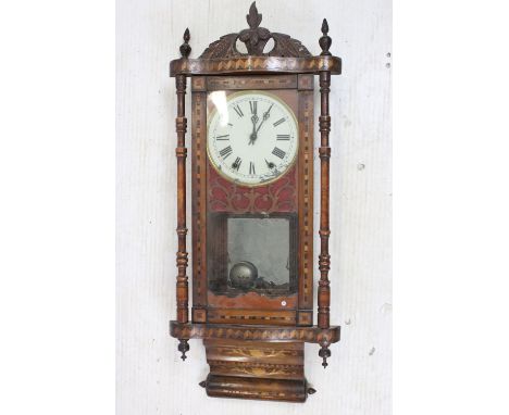 Antique marquetry bordered case clock with hand carved pediment, fret work around dial, turned pillars to each side with turn