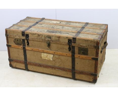 Antique travel trunk chest with wooden slat casing and burlap covering, with leather strapping and travel markings, H 49cm, W