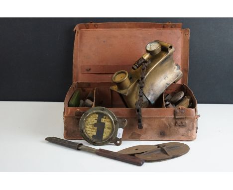 Small leather case containing antique car accessories to include a car vulcaniser with gauge, tax disk holder and tools, etc
